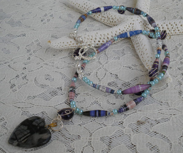 A long necklace using tube shaped paper beads (aubreysbeads.com) 