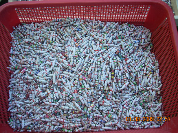 A basketful of paper beads after they dry